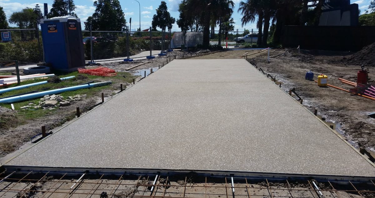 Exposed aggregate path in a cream stone blend, washed back with the forms on, Sunshine Coast