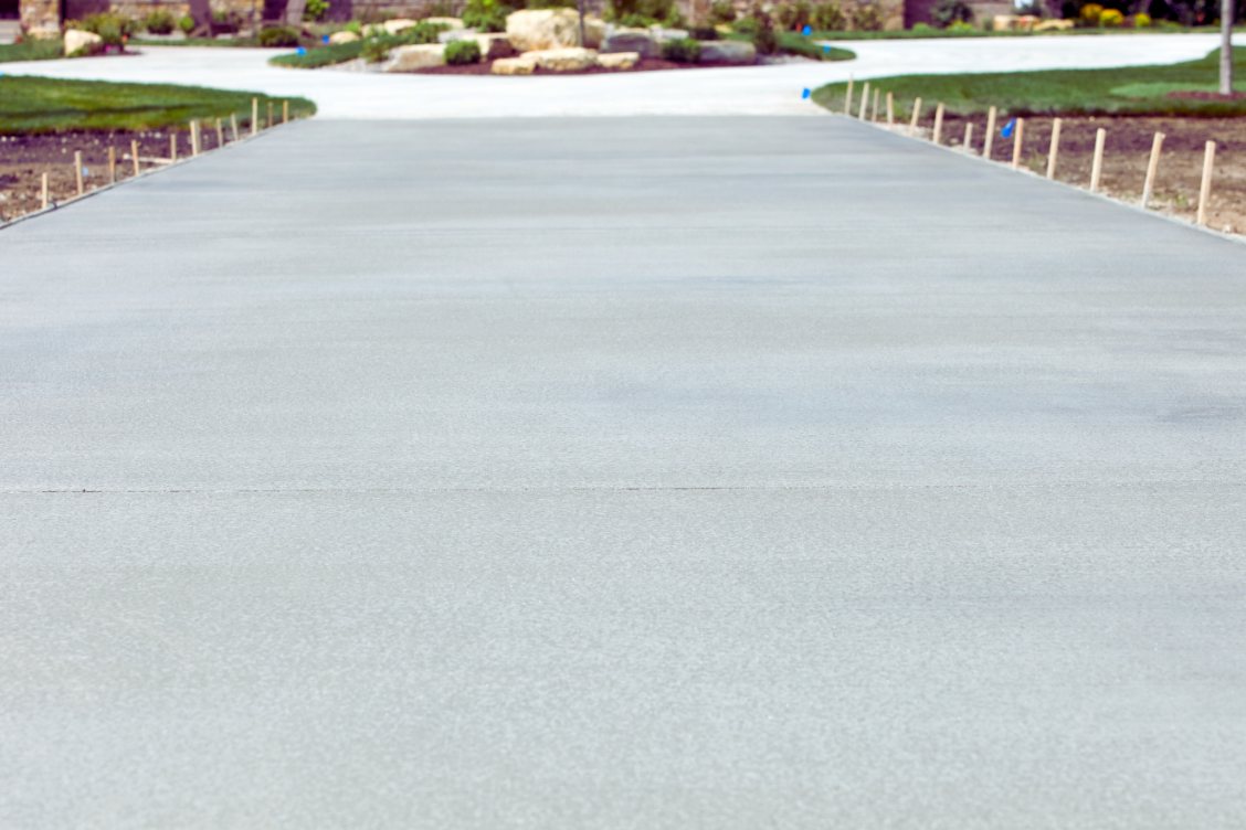 Plain grey concrete with a broom finish for grip