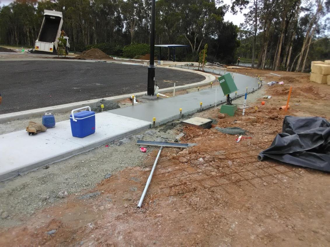 Plain concrete footpath poured along a curved kerb line, Sunshine Coast