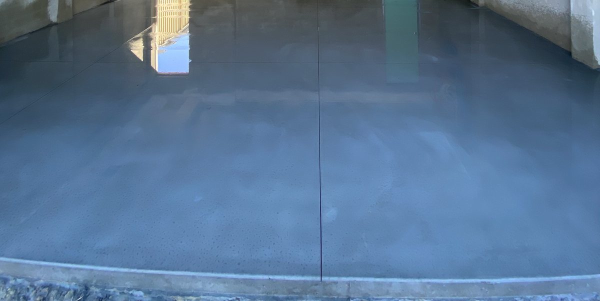 Concrete shed slab formed and poured with clean edges